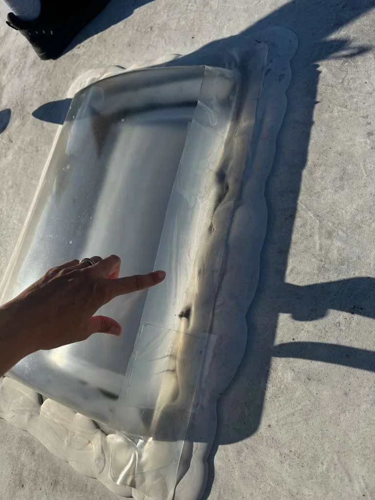 Damaged RV skylight with a hole that needs sealing or replacement