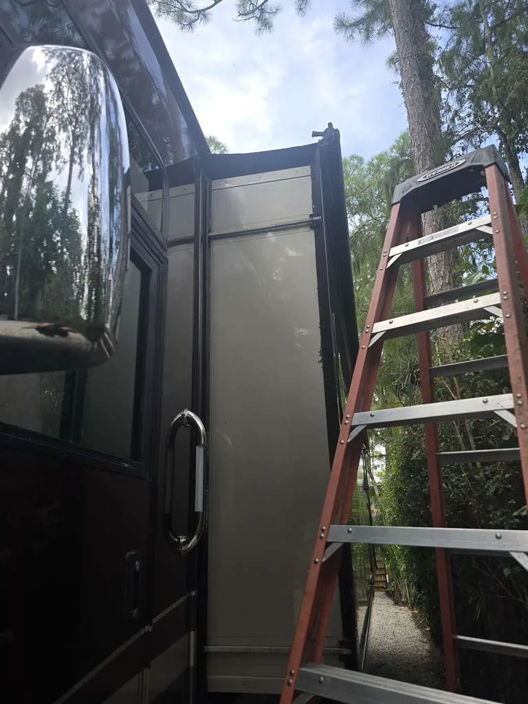 Working on a stuck RV slideout mechanism in Palm City